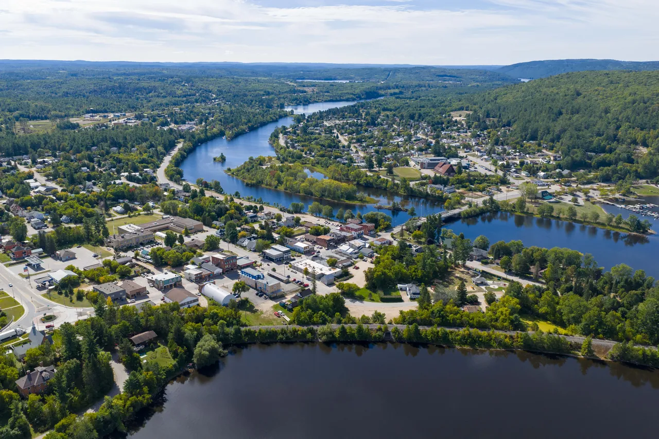 Aerial view of a river town and lake