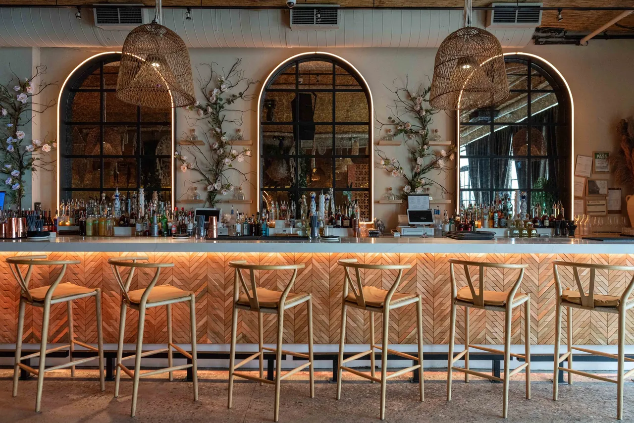 Restaurant bar with arched mirrors and warm lighting